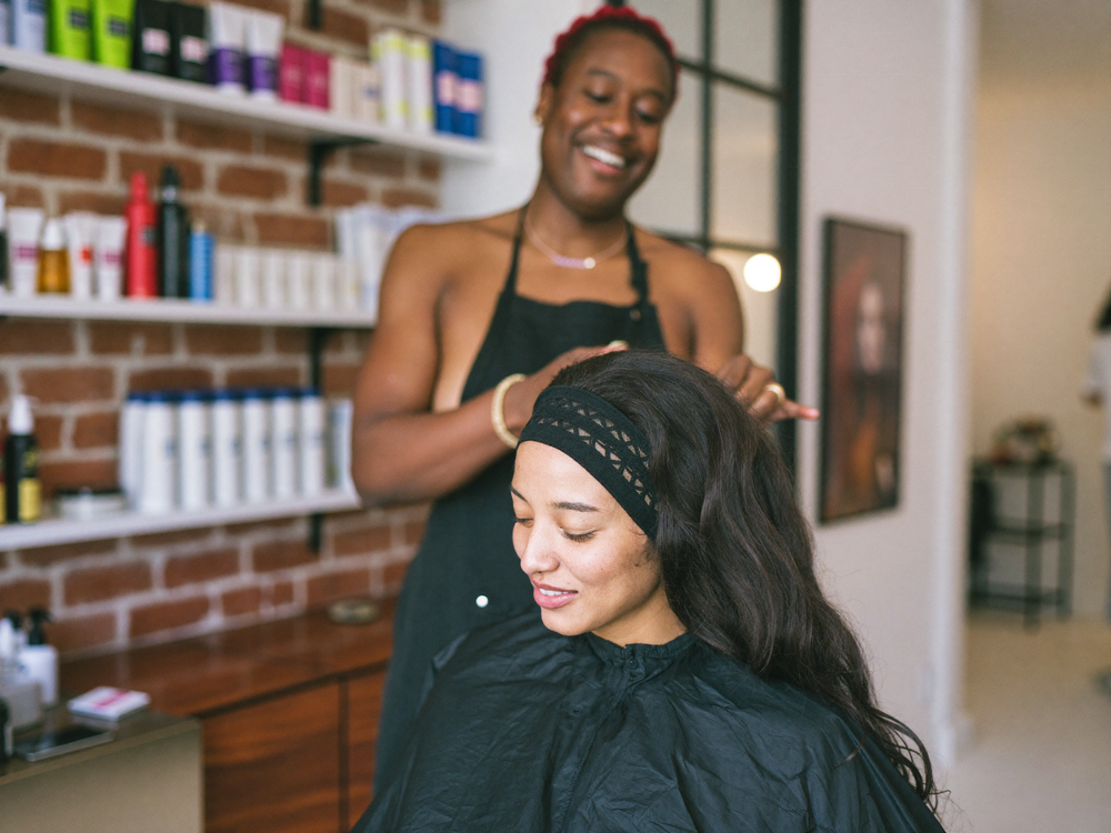 Stylist fitting a wig