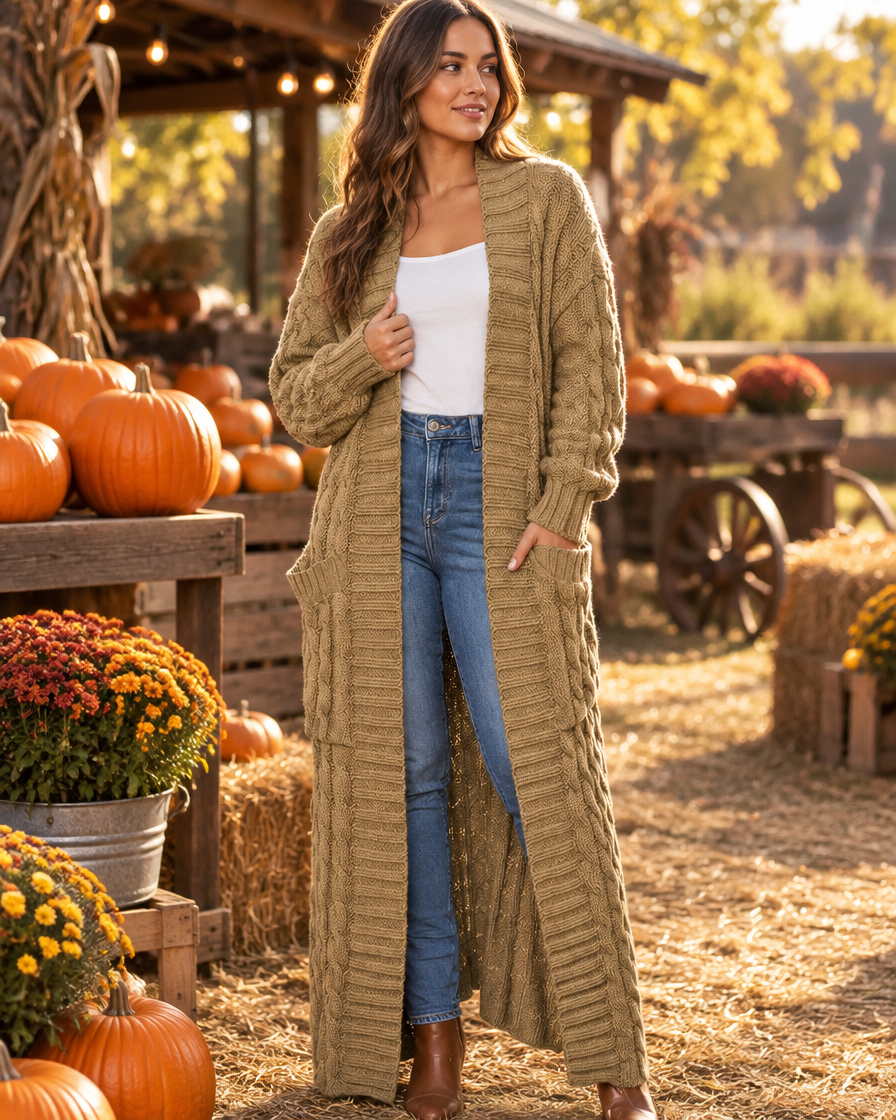 Khaki cable-knit maxi cardigan styled at an autumn pumpkin farm stand