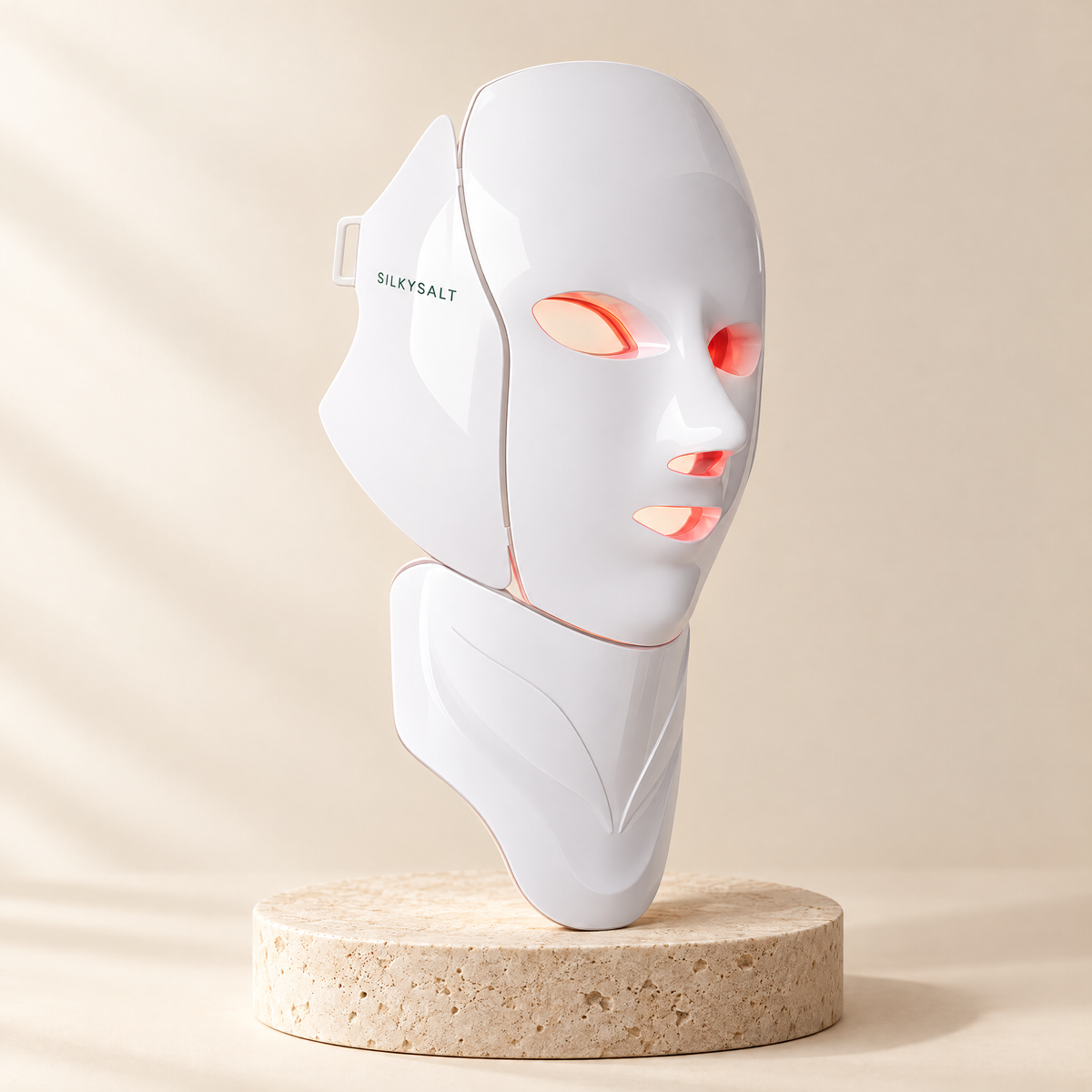 SILKYSALT LED face and neck mask on a pedestal