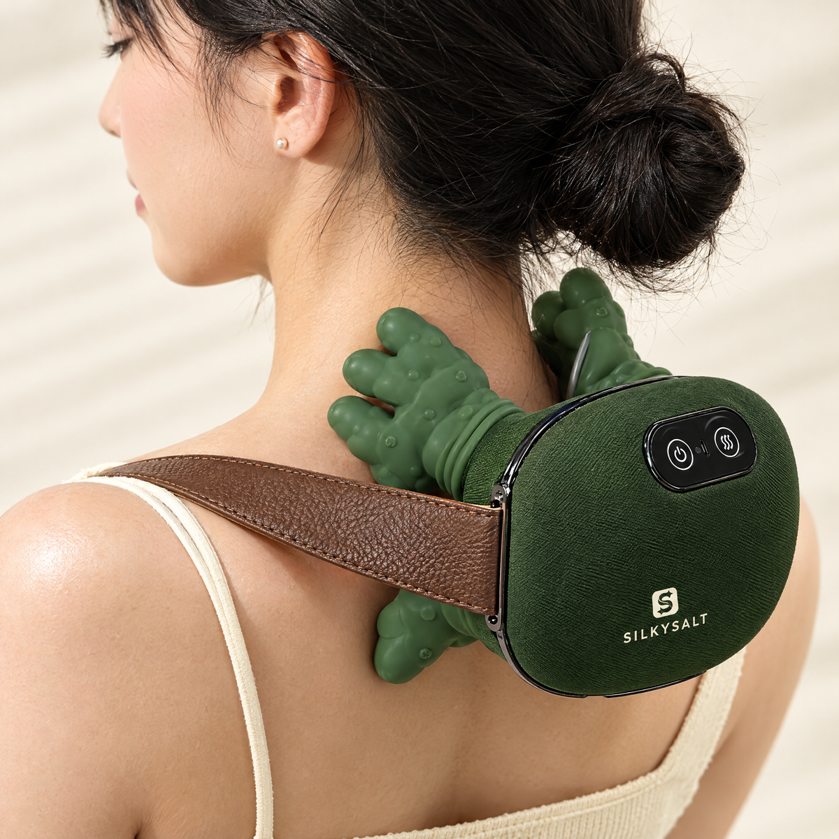 Close-up of SILKYSALT massager finger nodes on the shoulders